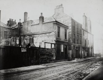 General view of houses at junction between North College Street and Hastie's Close, Edinburgh, prior to demolition.
