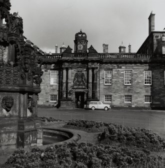 General view of main entrance to courtyard with part of fountain in foreground.