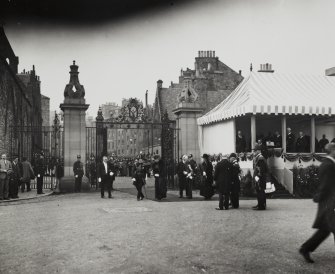 General view of unveiling ceremony for Memorial to King Edward VII (unseen behind canopy and platform), showing gates, looking West from Holyrood Palace forecourt