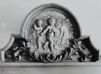 Interior-detail of carved plaque above door in Hall
