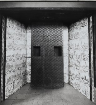 Interior-detail of empty fireplace in Reading Room showing Dutch tiling