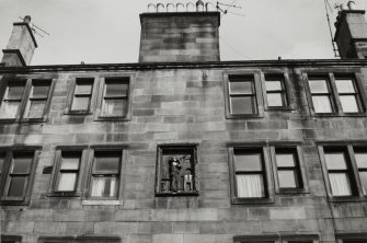 Edinburgh, 73-91 Holyrood Road.
Detail of upper part of building showing sculptured panel.
