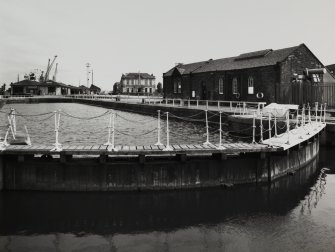 Tower Place, Hydraulic Power Station.
View from North West with dock gates in foreground.