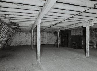 Interior view of top floor level of 6 Maritime Street (wooden columns 0.15m square)