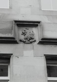 Detail of carved panel in facade of 6 Maritime Street