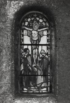 Interior, war memorial chapel, detail of stained glass window at north end