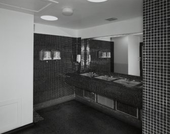 Interior. 1st floor, ladies lavatories, view showing wash hand basins and mosaic tiling
