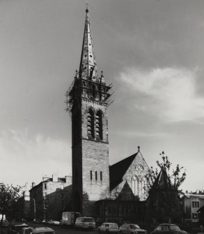General view of St Peter's Church with scaffolding on the spire seen from the West.