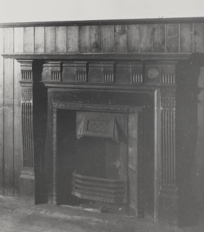 Interior of church hall at Lothian Parish Church: detail of cast iron fireplace