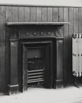 Interior of church hall at Lothian Road Church: detail of cast iron fireplace