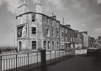 Newhaven, Fishermen's Hall, 56-58 Main Street, and 12 Pier Place.
View from South West of West end of Main Street, showing 1-8 Main Street prior to redevelopment.
