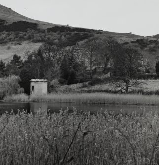 Distant view from S with loch