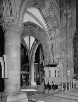 Interior.
View of pulpit and archways at junction of nave, aisle and NW transept.
