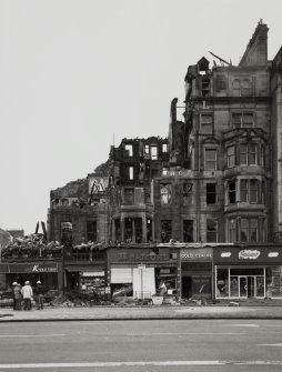 View of south elevation after blaze and during demolition.