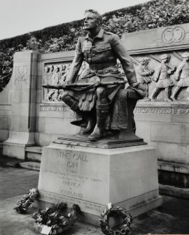 View from south east of memorial showing statue in detail and three wreaths at its base.