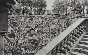 Photographic copy of a postcard.
View of floral clock.
Titled: 'The Floral Clock. (keeps accurate time)', 'Jas. Ritchie & Son / Makers'.