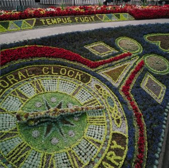 View of floral clock and 'Tempus Fugit' floral border from south west