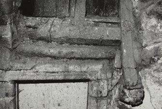 Edinburgh, Quayside Street, Quayside Mills, Manse.
Detail of head of doorway in Manse, top of stair wrought with edge-roll, and ashlar piece of Manse wall projecting through wall.