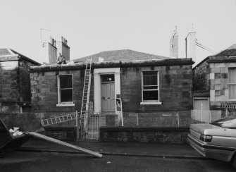 View from East South East showing street frontage, garden walls and gates