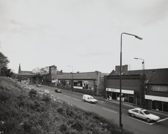 General view from west of brewery buildings, also showing old railway bridge