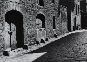 Edinburgh, Timber Bush.
View of row of fenders at entrances to old industrial premesis.