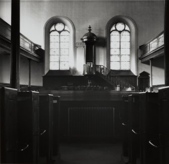 Interior showing pulpit and former windows.