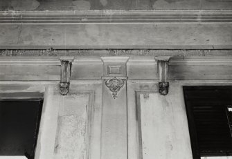 Detail of pilaster head and corbels in first floor hall.