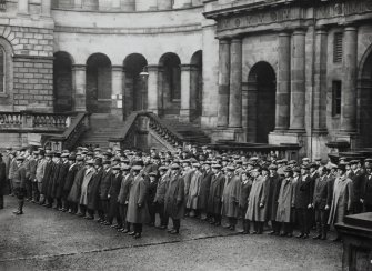 University of Edinburgh Old College.
View of men standing in military fashion in main courtyard.