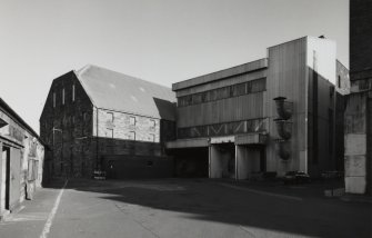 View from S of SW end of maltings blocks, showing steel-framed extension associated with the conversion to Saladin-Box maltings