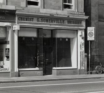 View of "Chemist G. Somerville. Druggist" shopfront from ESE