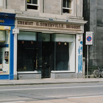 View of "Chemist G. Somerville. Druggist" shopfront from ESE