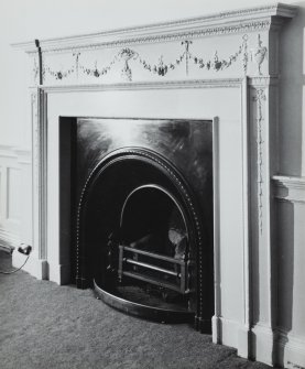 Interior, view of first floor front apartment fireplace.