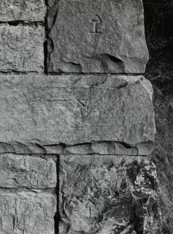 Detail of mason's marks at base of arch