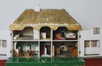 View of dolls house, design inspired by the Welsh Cottage at Windsor (open)