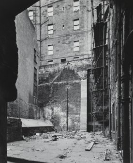 View of courtyard from S, showing site of demolished tenement.