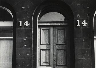 Detail of large numerals at doorway.