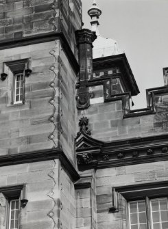 Detail of chimney, shield and carved pediment on south front