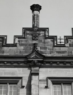Detail of chimney, shield and carved pediment on south front