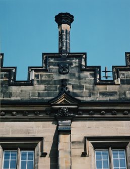 Detail of chimney, shield and carved pediment on south front
