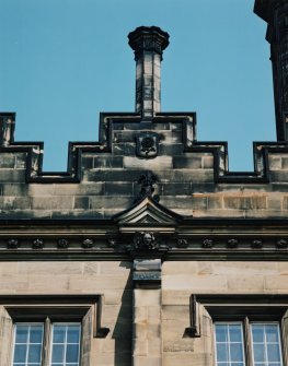 Detail of chimney, shield and carved pediment on south front