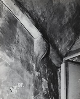 Interior.
Detail of head of staircase showing corbel supporting wall plate.