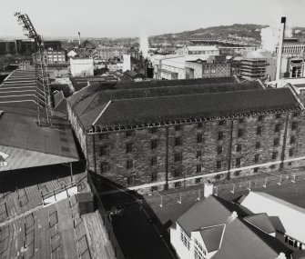 Elevated view from east south east (on floodlight tower of Tynecastle Stadium) of Duty Free Warehouses No. 5, with Duty Free warehouse No. 1 (extreme left), Still House (right) and in distance, Blandfield Chemical Works