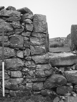 Grumby farmstead: detail of infilled cruck-slot and  window in N wall of primary building in main range