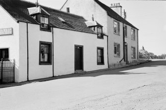 General view of Machany Cottage, 4 The Cross, Muthill, showing sign for Williamson, Cement Worker.