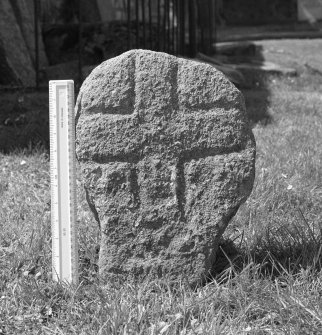 Early medieval cross slab with scale