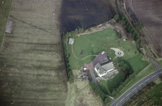 Oblique aerial view centred on the remains of an anti-aircraft battery, taken from the WSW.