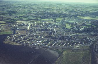 Oblique aerial view centred on the oil refinery, taken from the NE.