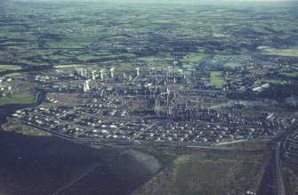 Oblique aerial view centred on the oil refinery, taken from the NE.