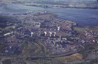 Oblique aerial view centred on the oil refinery, taken from the SW.