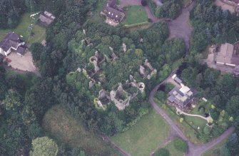Oblique aerial view centred on the remains of the country house, taken from the SSE.